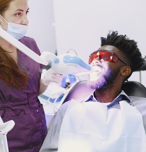 teeth-whitening-swift-current patient getting teeth whitening in swift current