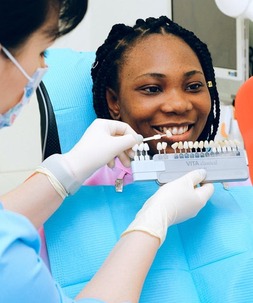 dentists testing lumineers on patient